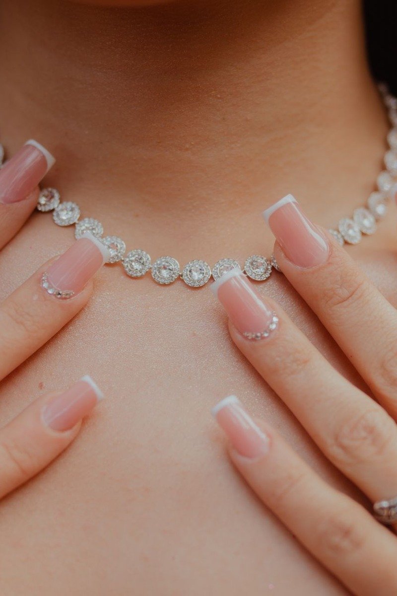 Lace patterned nails with tiny pearl accents