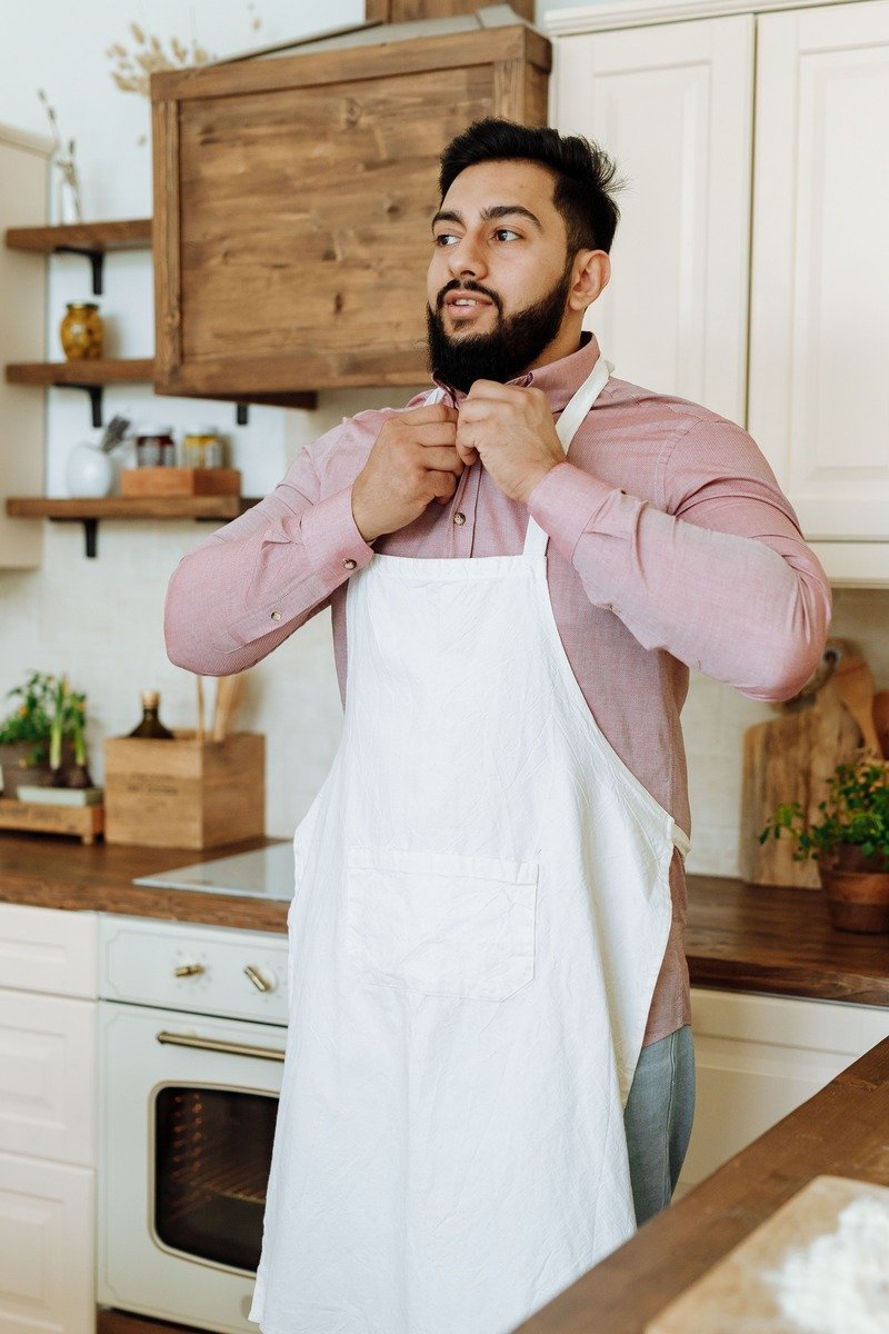 Canvas work apron being tied on