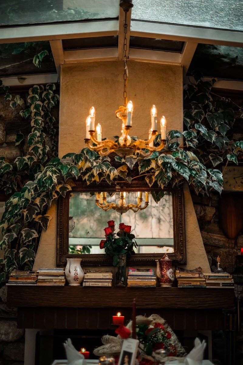Stacked books with a small bowl on a mantel