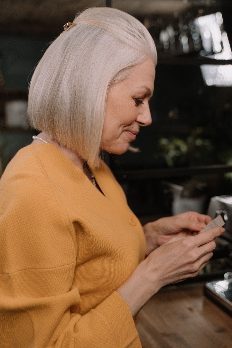 Woman over 50 with a chin length bob and side part
