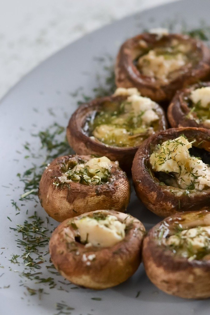 Stuffed mushrooms with breadcrumb topping on a plate