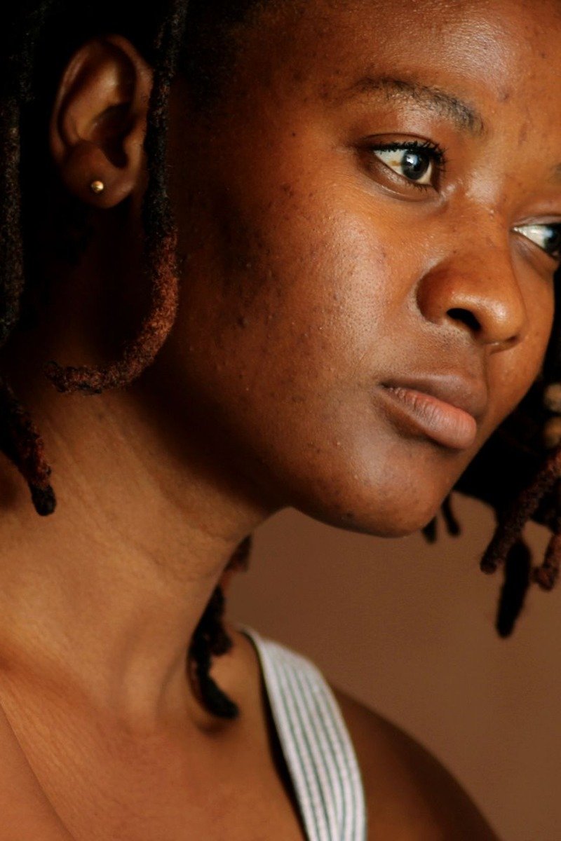 Short locs bob on a Black woman