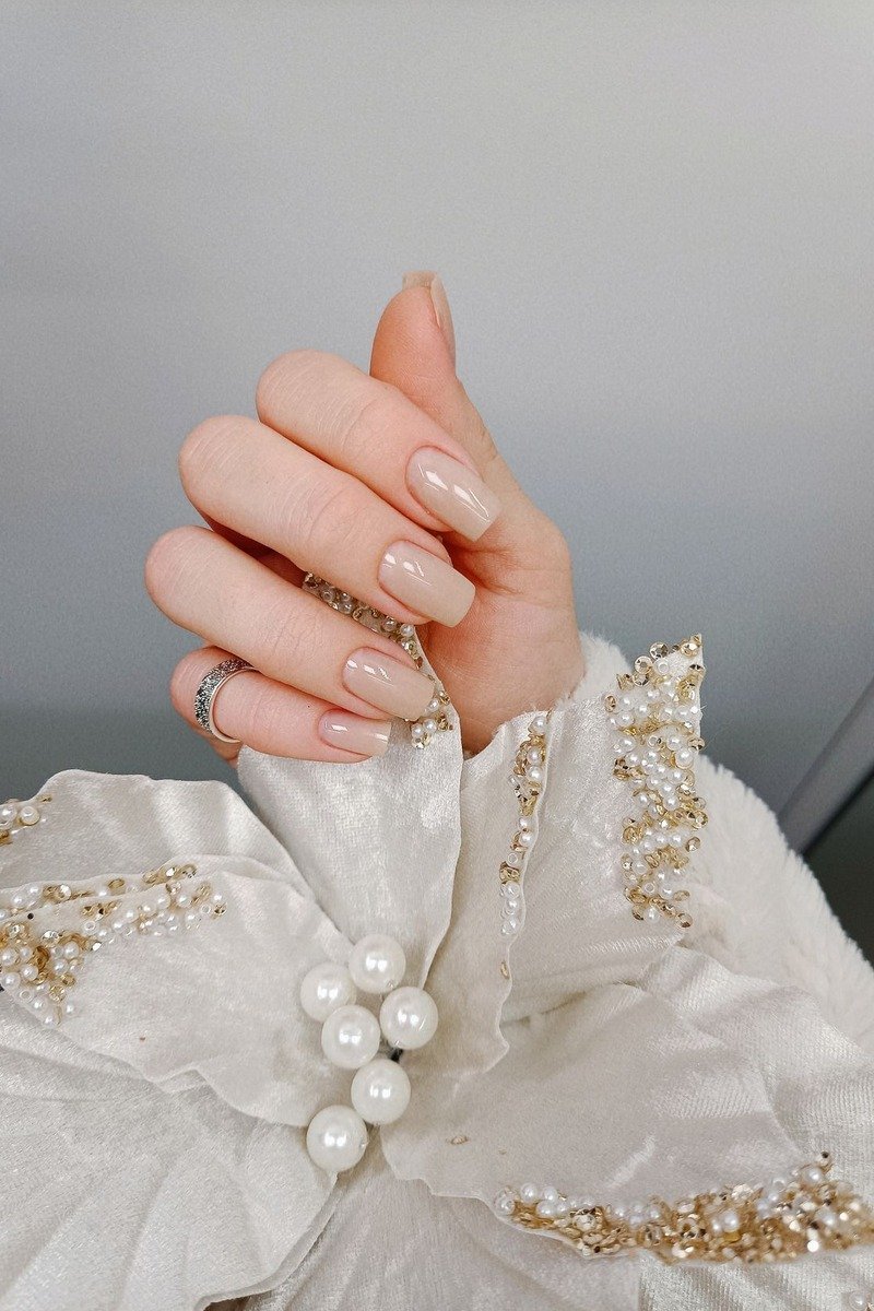 Nude nails with beaded pearl fabric, soft bridal styling