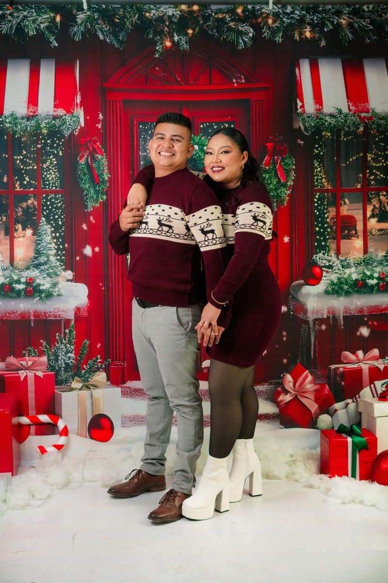 Couple wearing matching Fair Isle Christmas sweaters