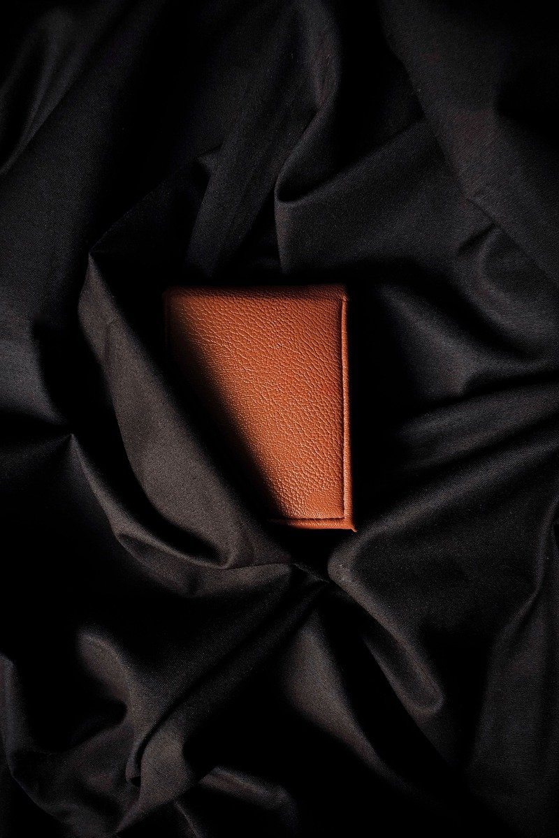 Brown leather wallet on a table