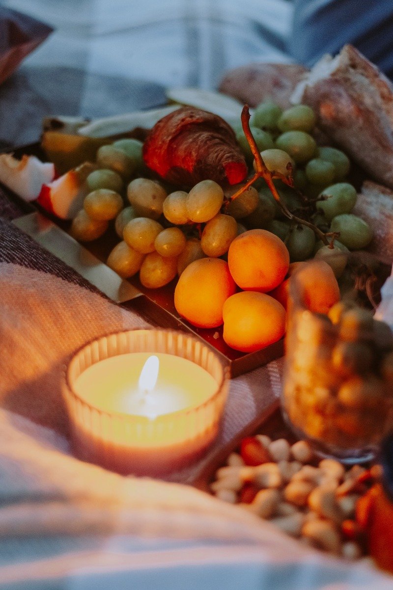 Indoor picnic spread on a blanket