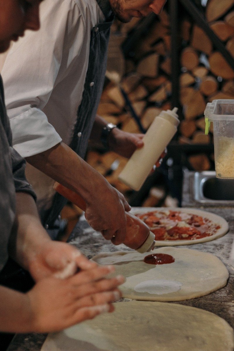 Homemade pizzas with toppings on a counter