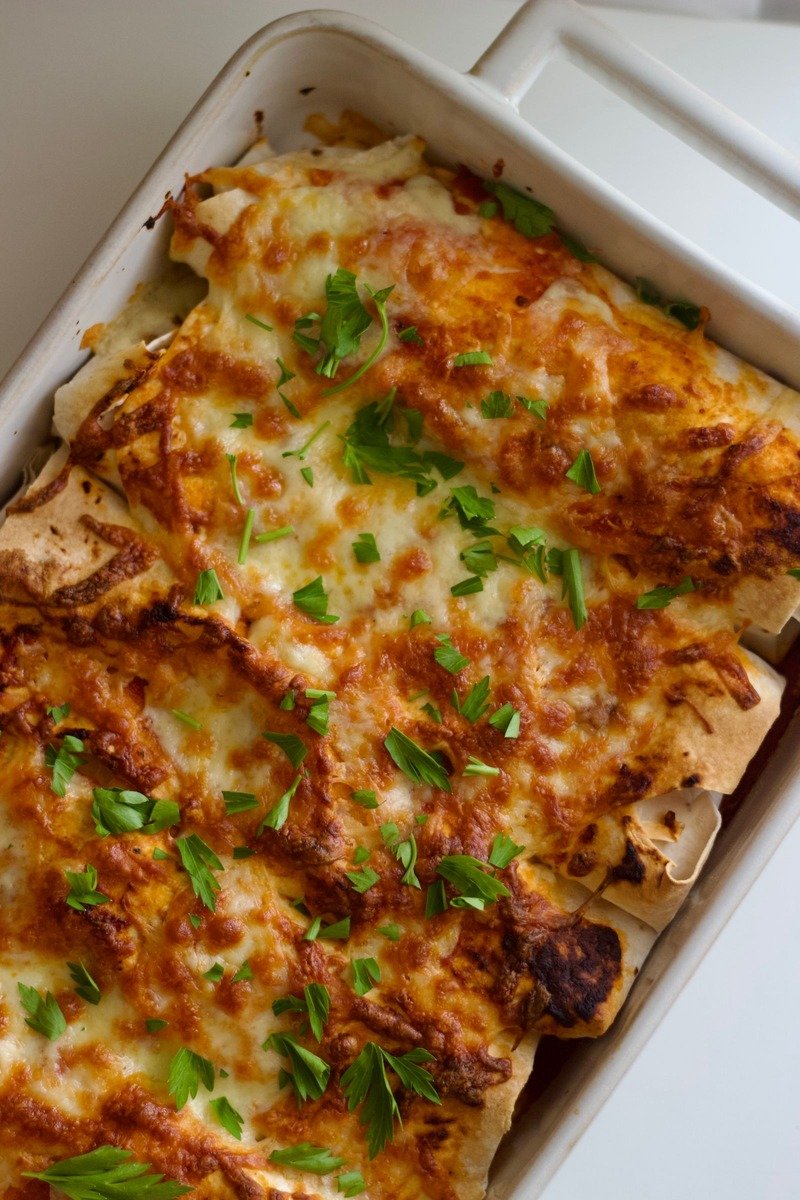 Bean and cheese enchiladas on a plate