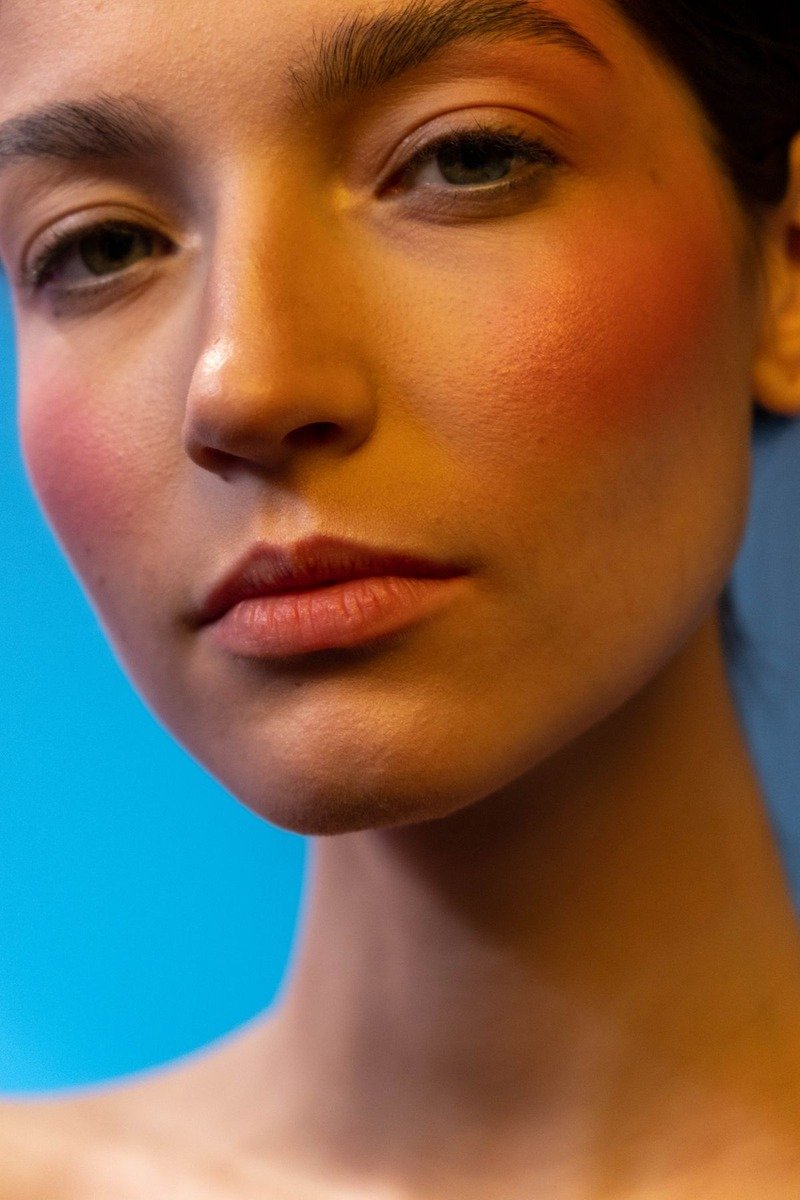 Buildable dusty rose blush swatched in light and heavy layers