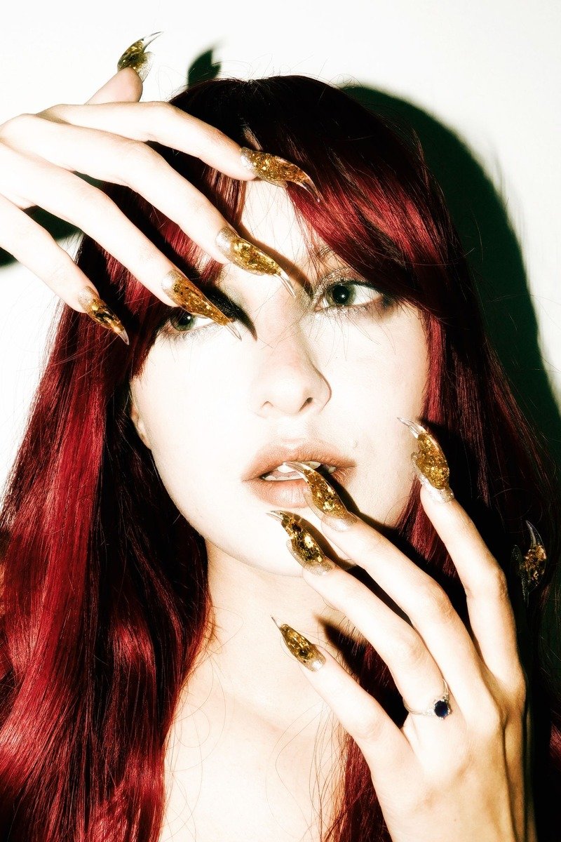 Long gold glitter stiletto nails