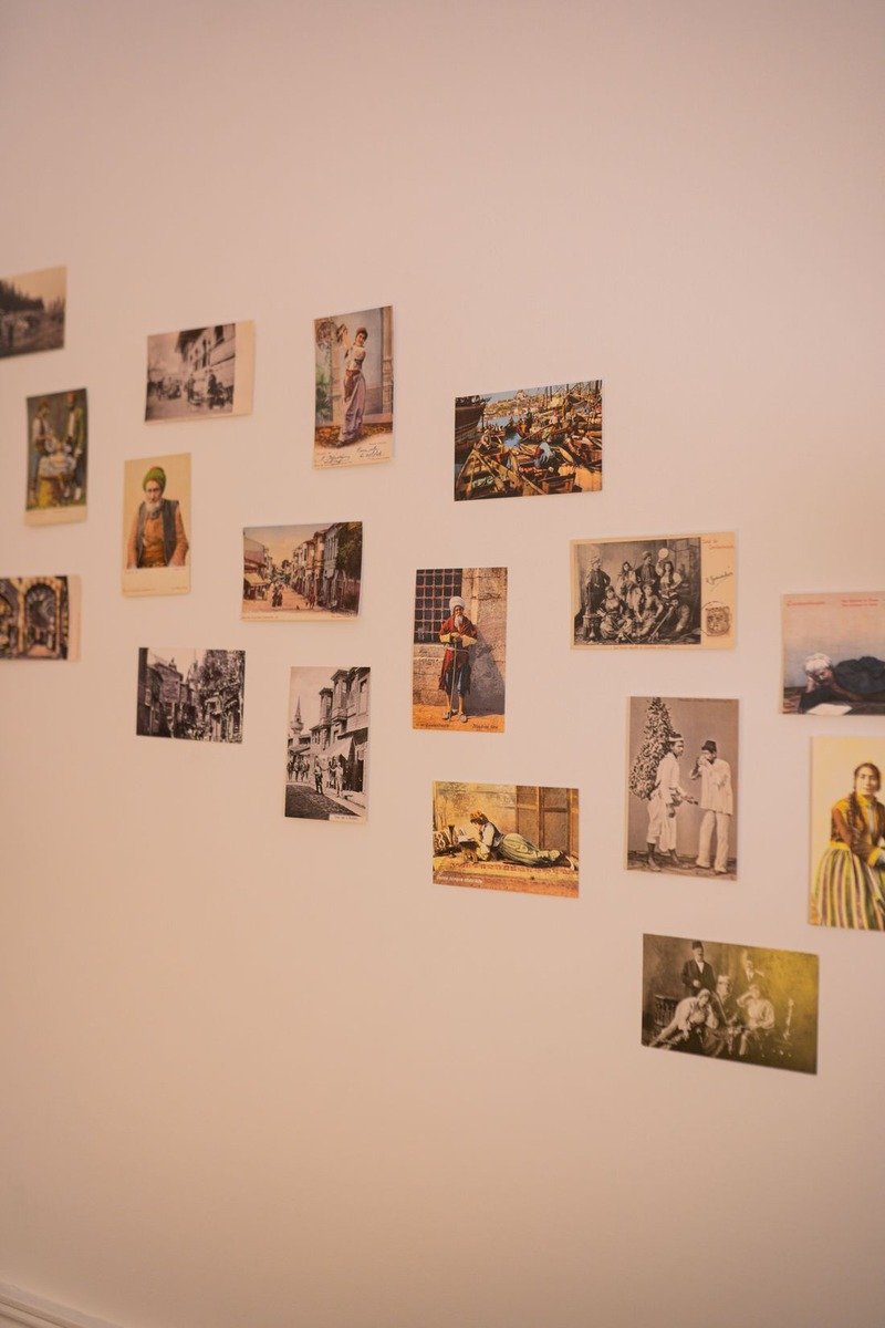Wall of photos showing memories at a milestone birthday party