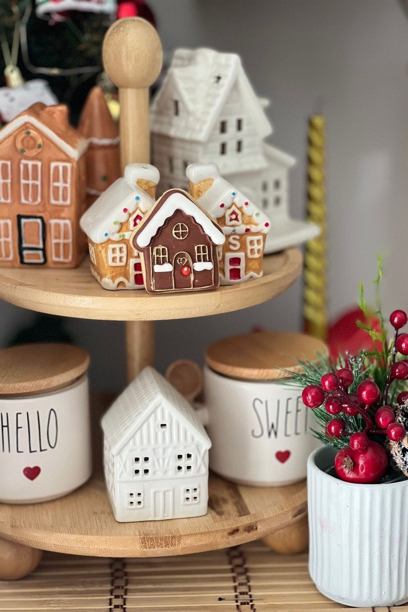 Christmas village arranged on a tiered tray