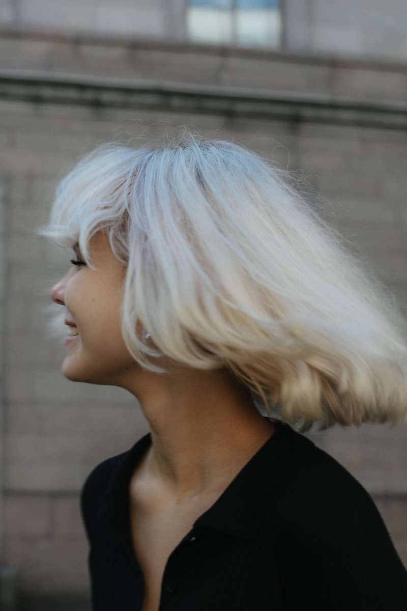 Icy platinum blonde winter hair color portrait