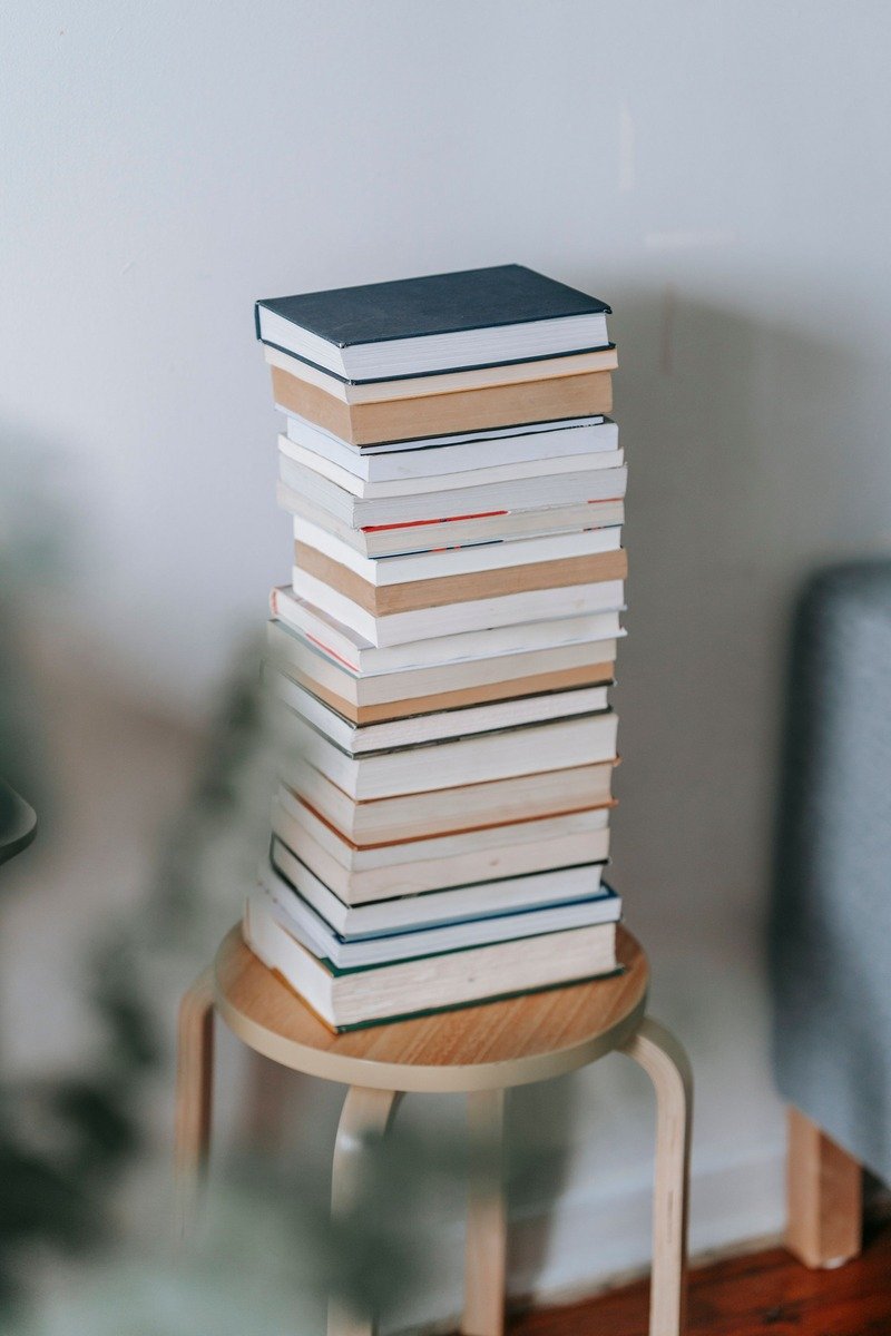 Stack of books on a wooden stool as a family gift