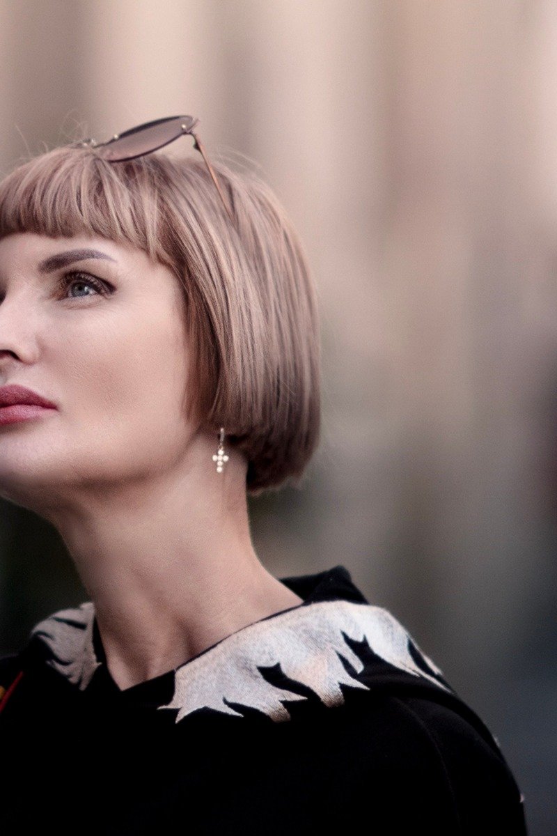 Woman over 50 with a blunt bob and bangs