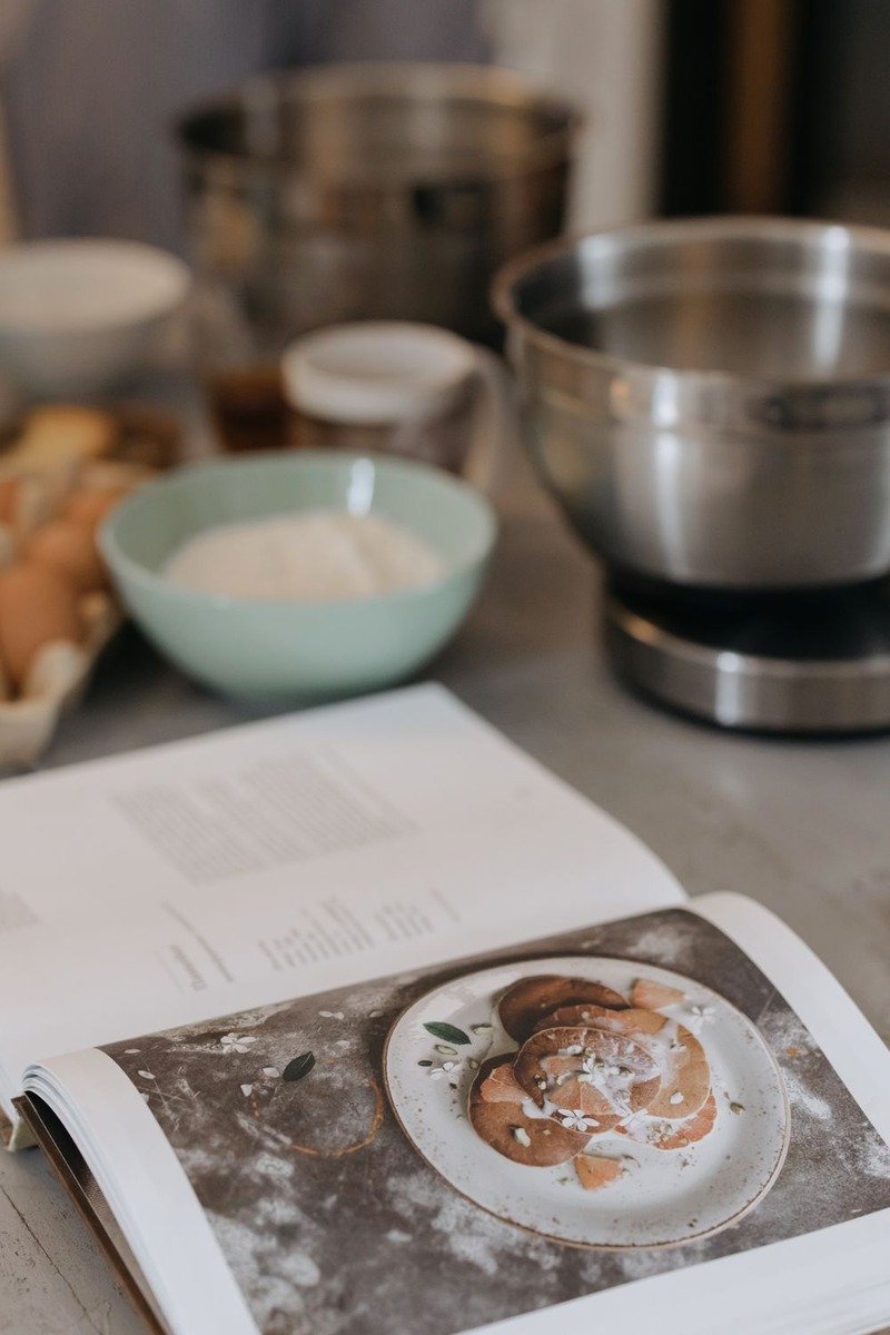 Cookbook open in a kitchen