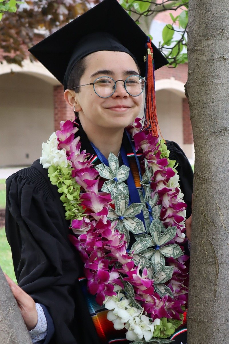 Graduate wearing a money lei