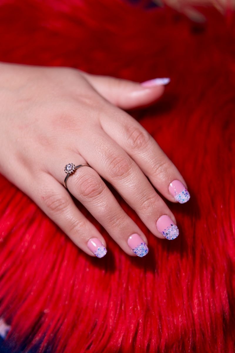 Nude nails with tiny clock faces showing midnight nail art