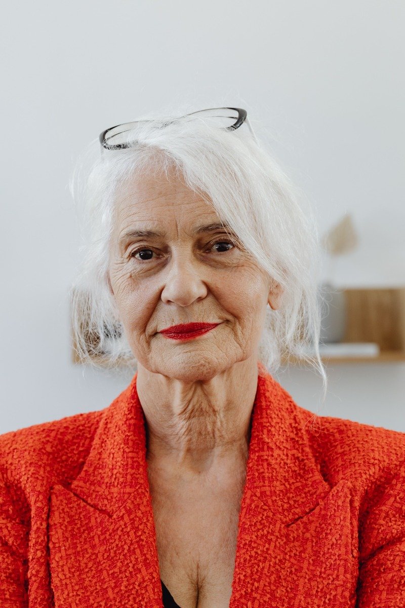 Woman over 50 with long white wavy hair