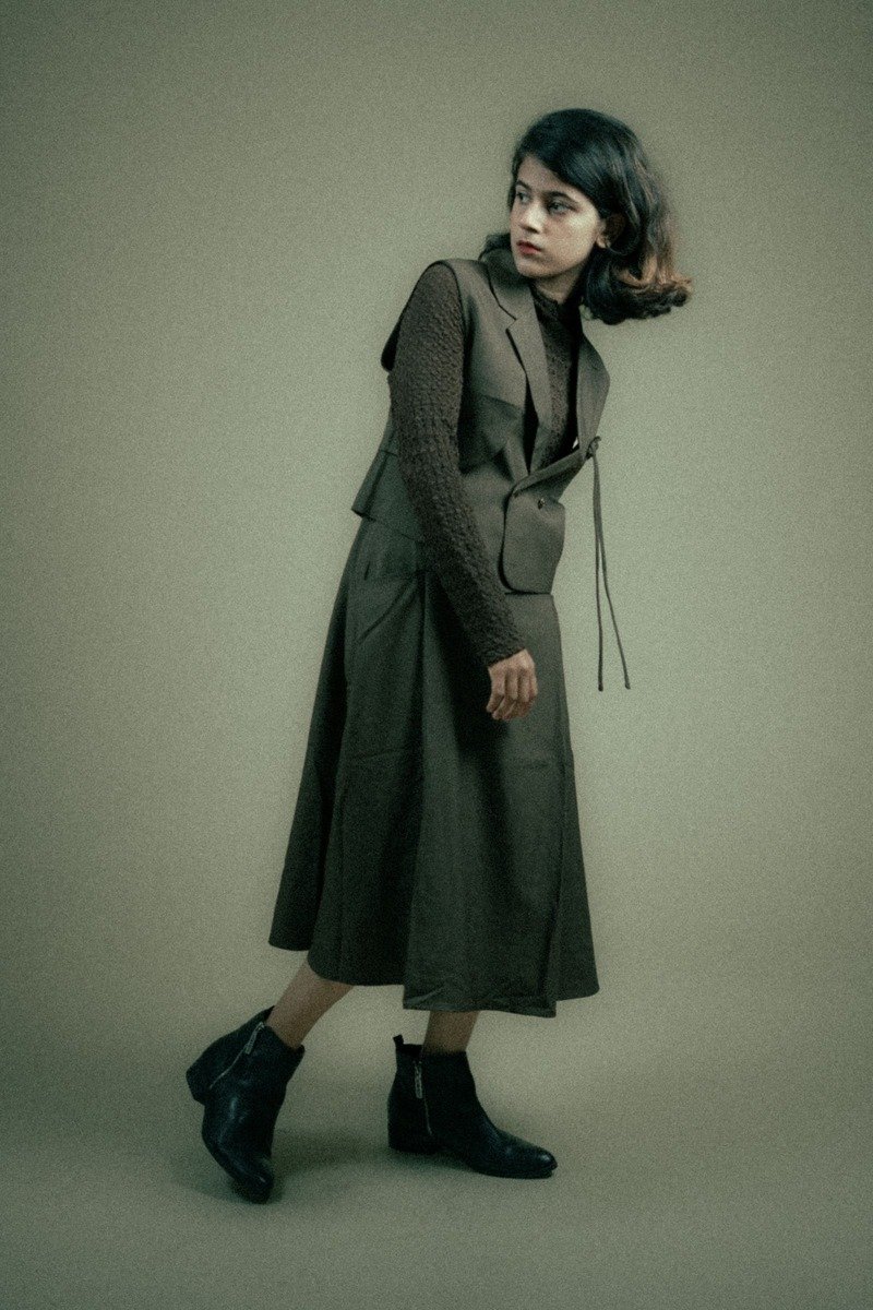 Woman in a matching knit skirt set