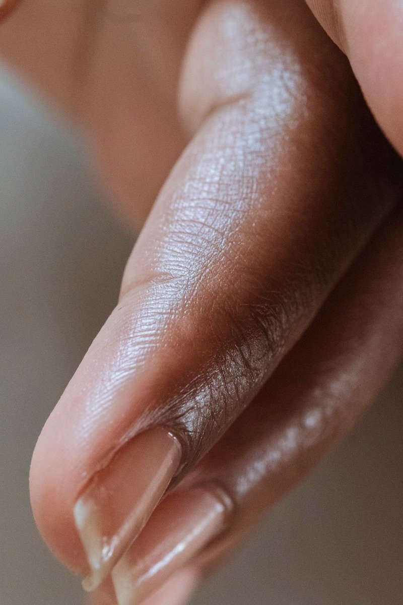 Nude nails with minimal caramel dot nail art