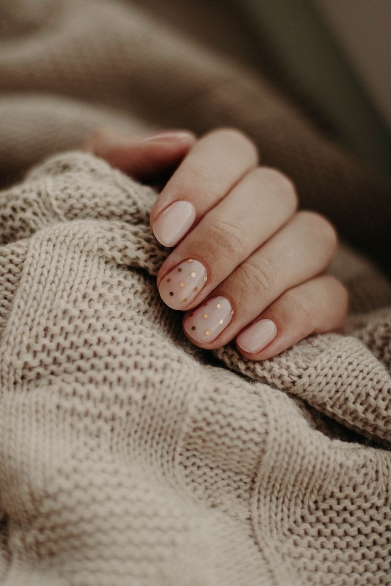Holographic glitter nail polish shifting colors in light