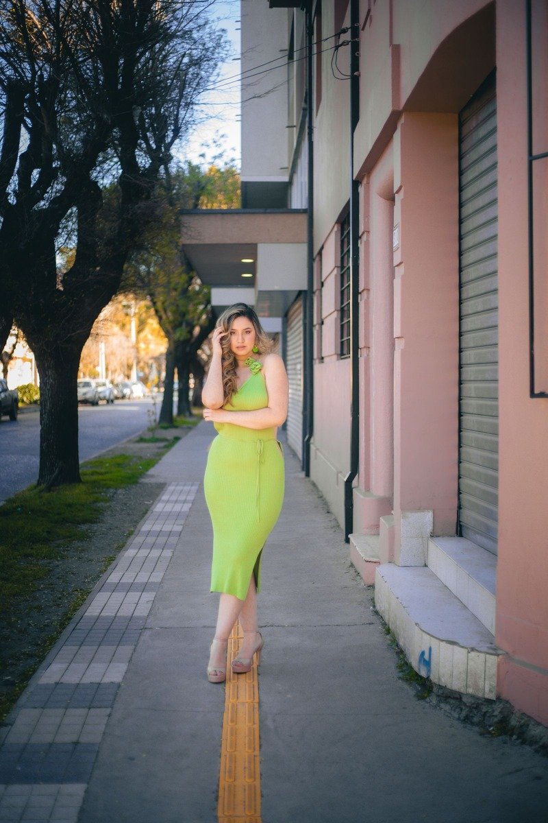 Woman in an all green monochrome outfit