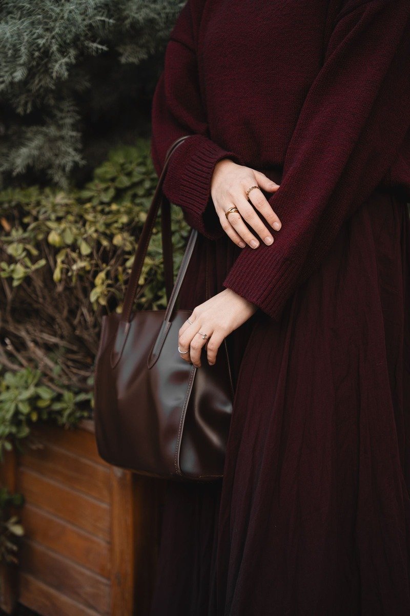 Woman in a burgundy monochrome outfit