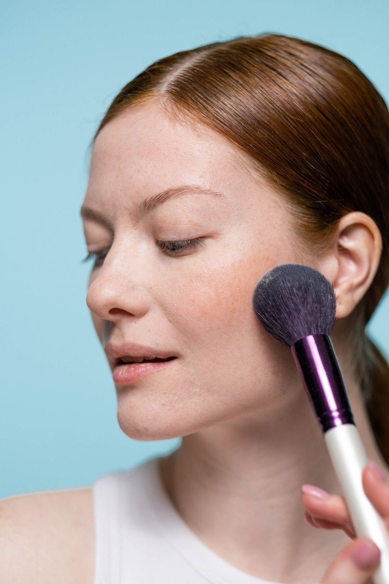 Light dusty rose blush on fair skin with soft flush