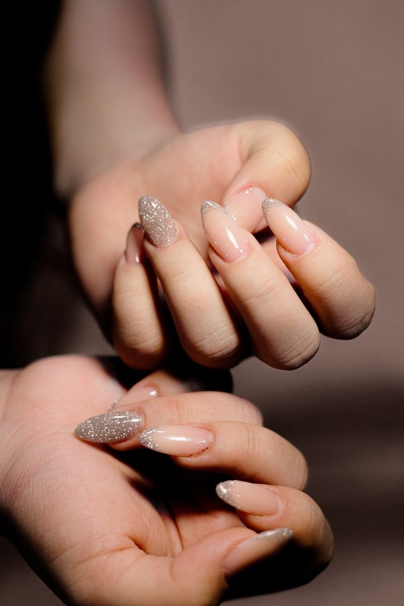 French manicure with gold glitter tips