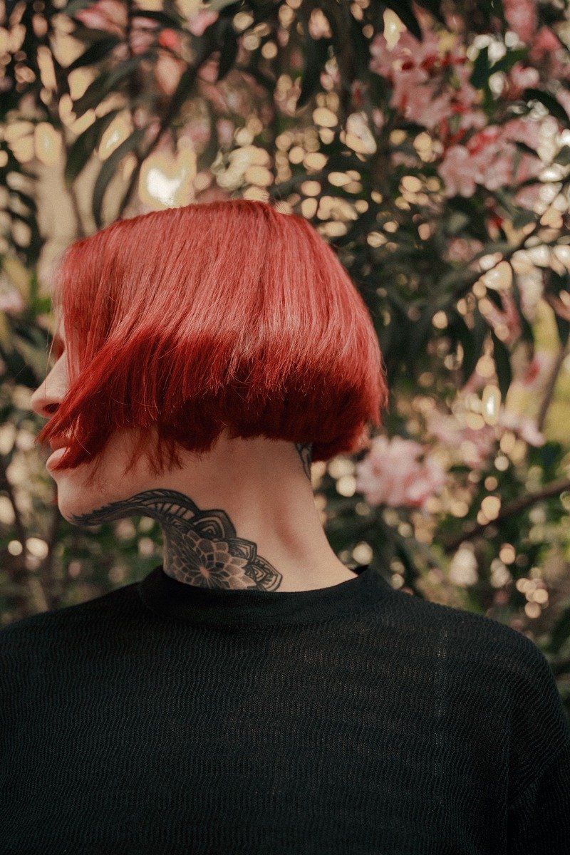 Long bob haircut in cherry cola color