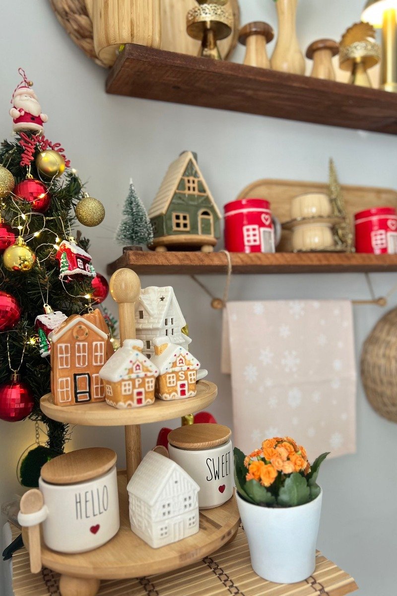 Small Christmas village on a kitchen shelf