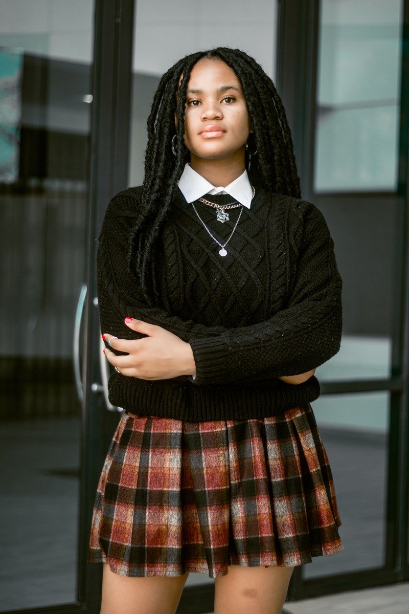 Plaid mini skirt with a black sweater