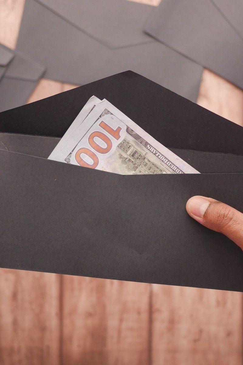 Cash gift in a black envelope