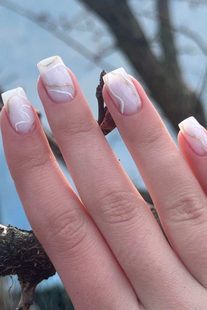 Champagne gold nails with delicate lace overlay