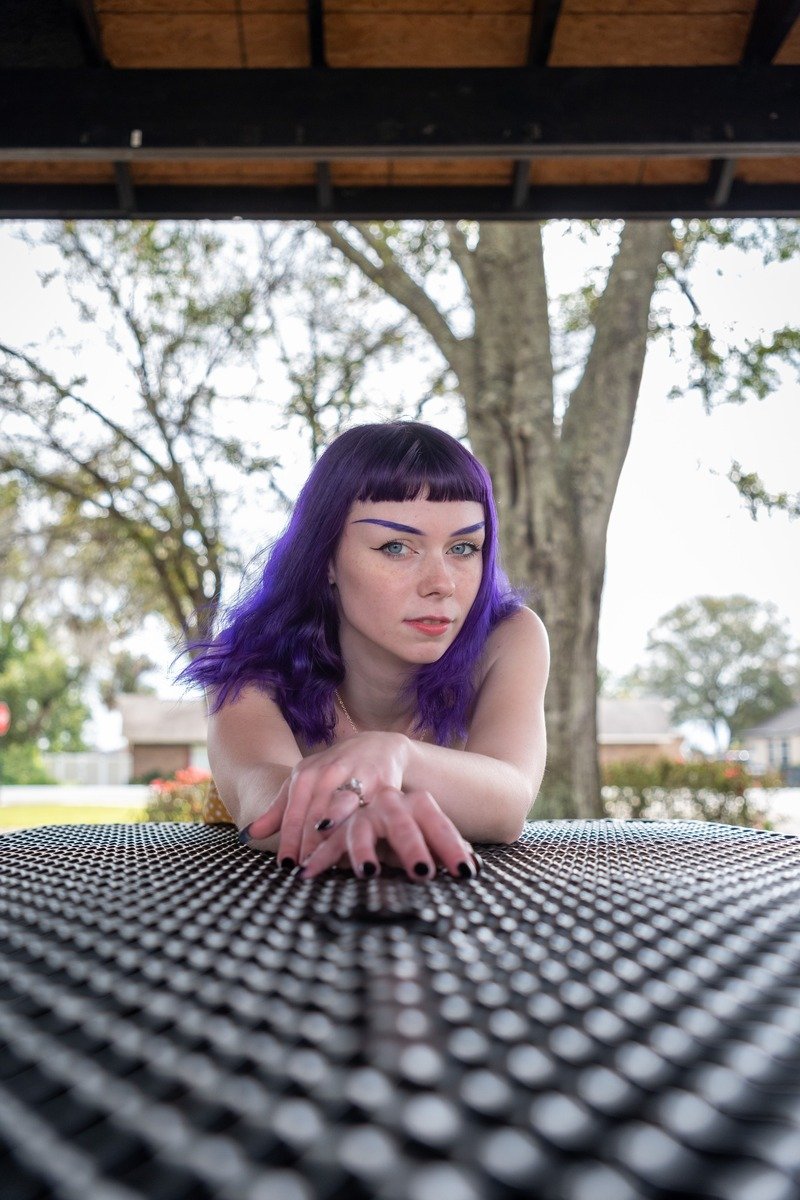 Purple plum winter hair color on a woman