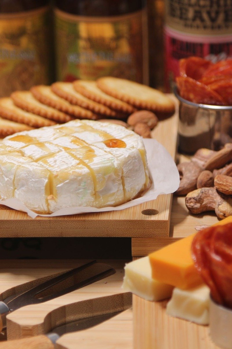 Easter basket with cheese and crackers on a board