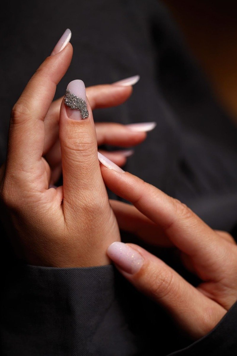 Black nails with metallic gold French tips