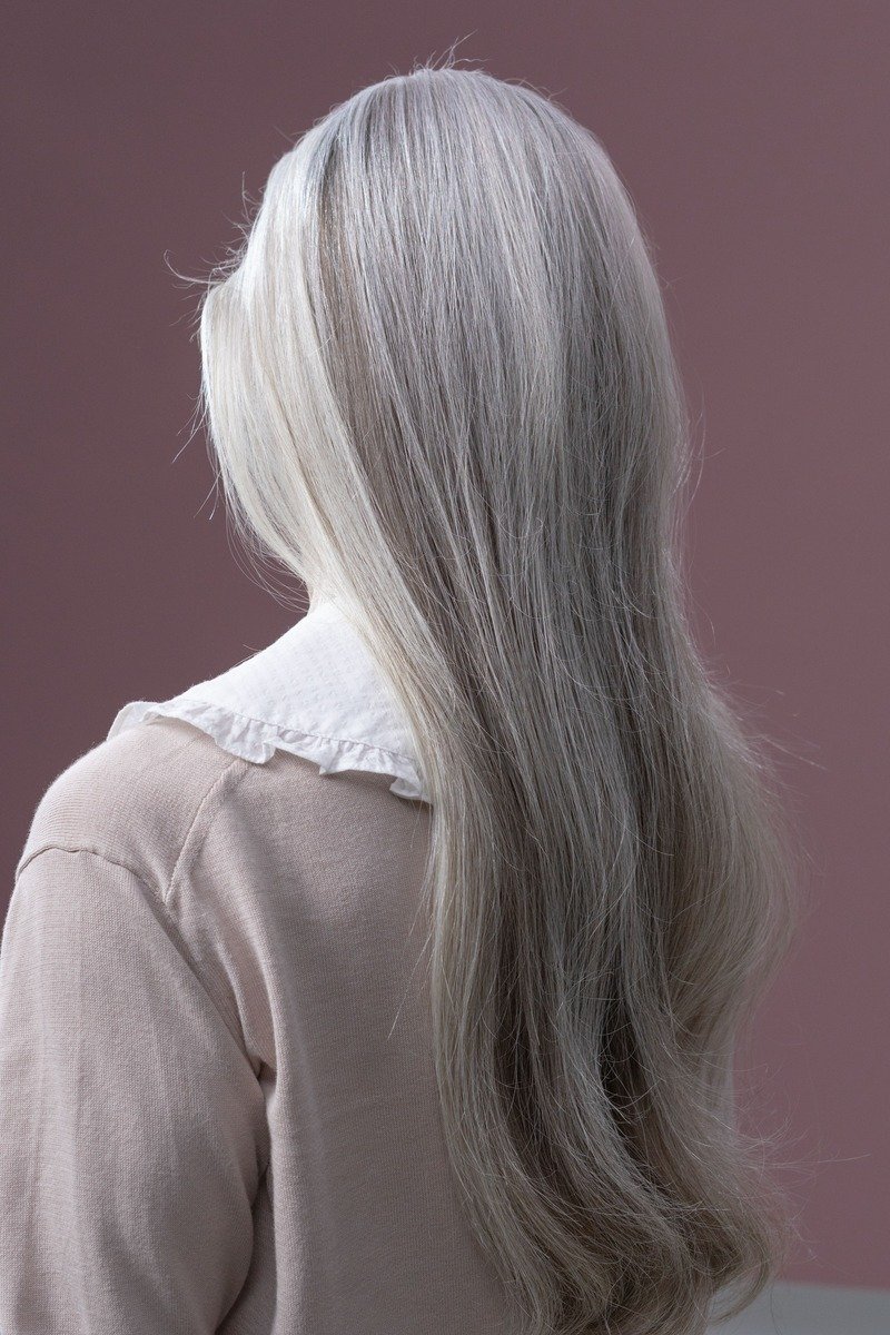 Back view of long hair with a natural grey blend
