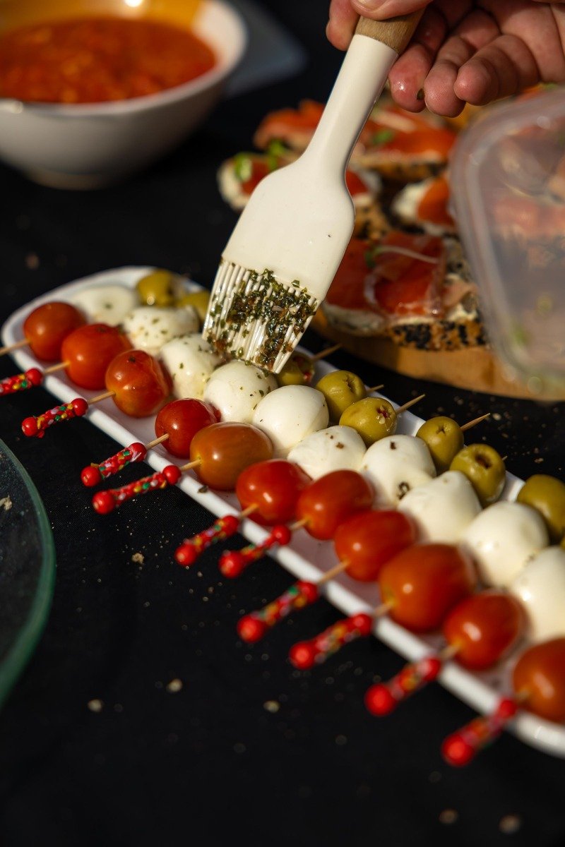 Caprese skewers with tomatoes mozzarella basil and olives