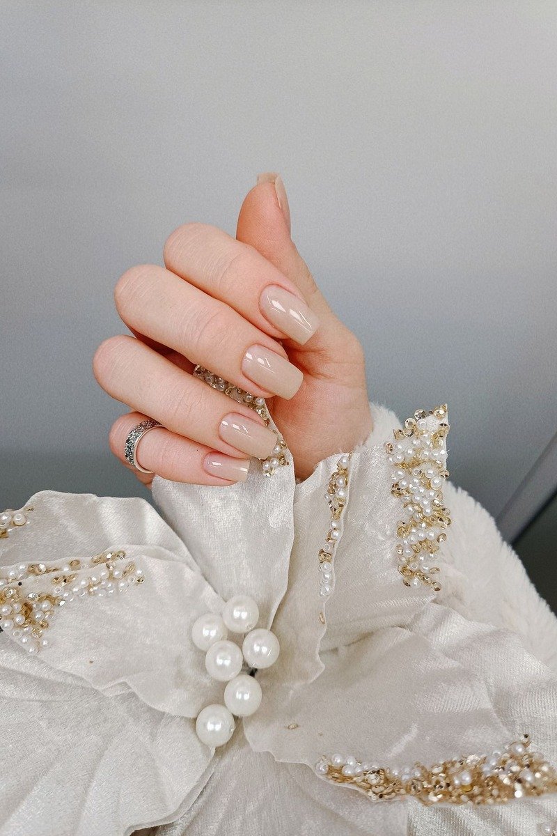 Caramel nails with half-moon design at the cuticle