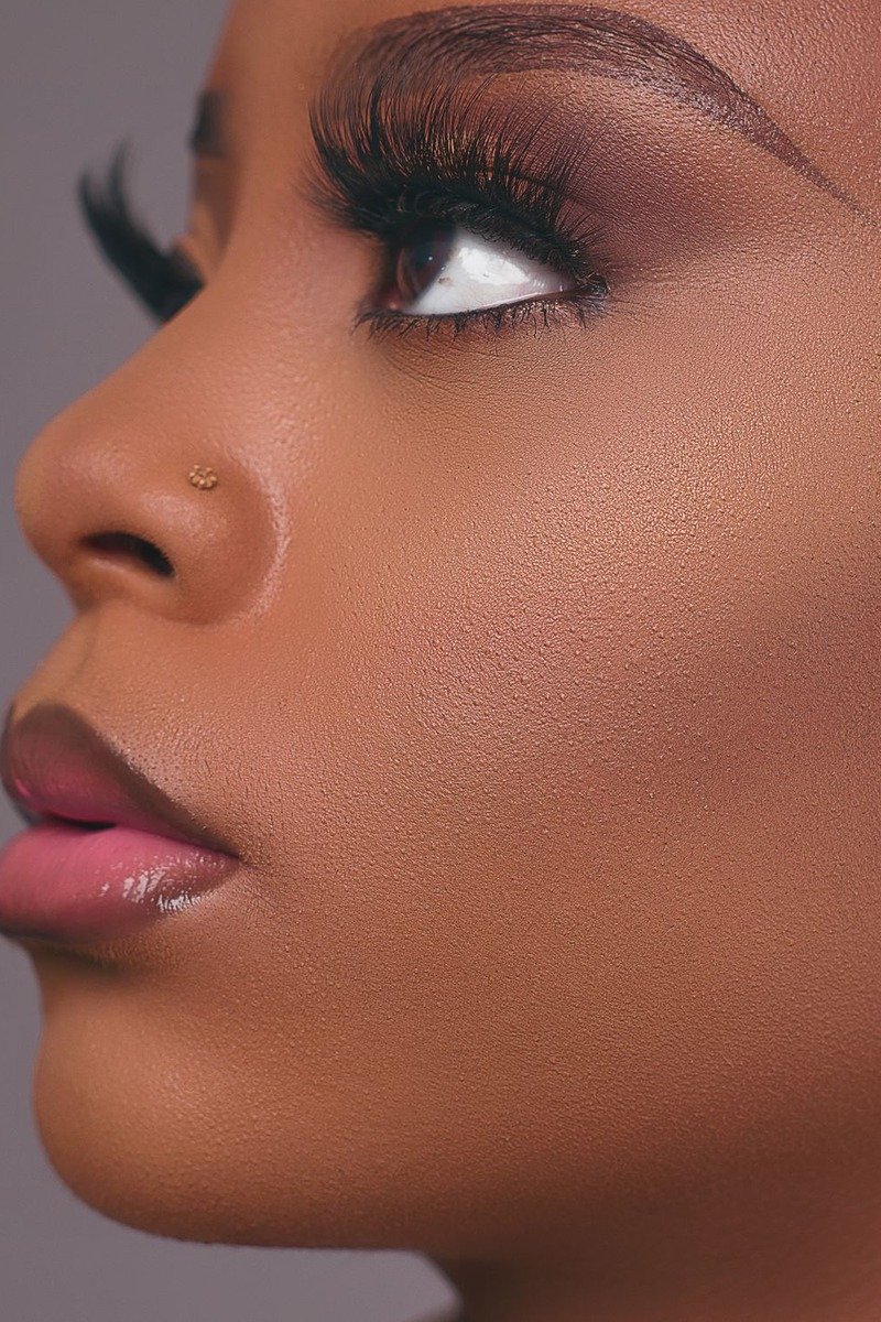 Soft neutral eye makeup paired with cloud skin base