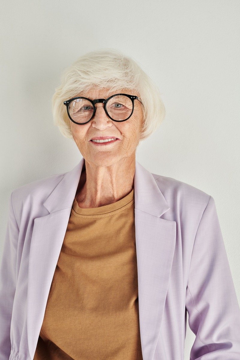 Woman over 50 with a natural grey bob haircut