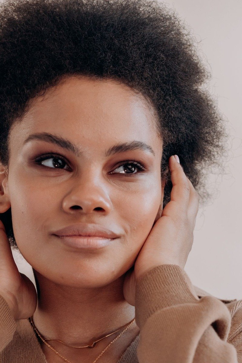 Defined natural curls on a Black woman