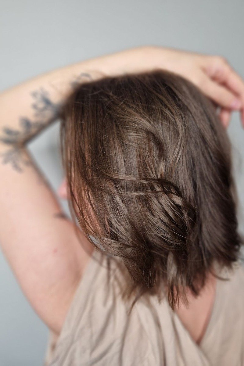 Lived-in mocha balayage with soft natural grow-out on long hair