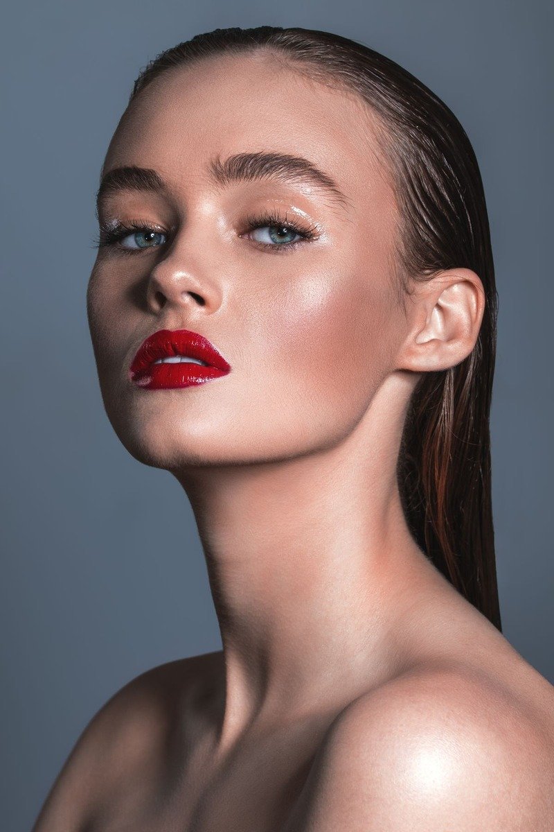 Glossy lip color complementing cloud skin makeup