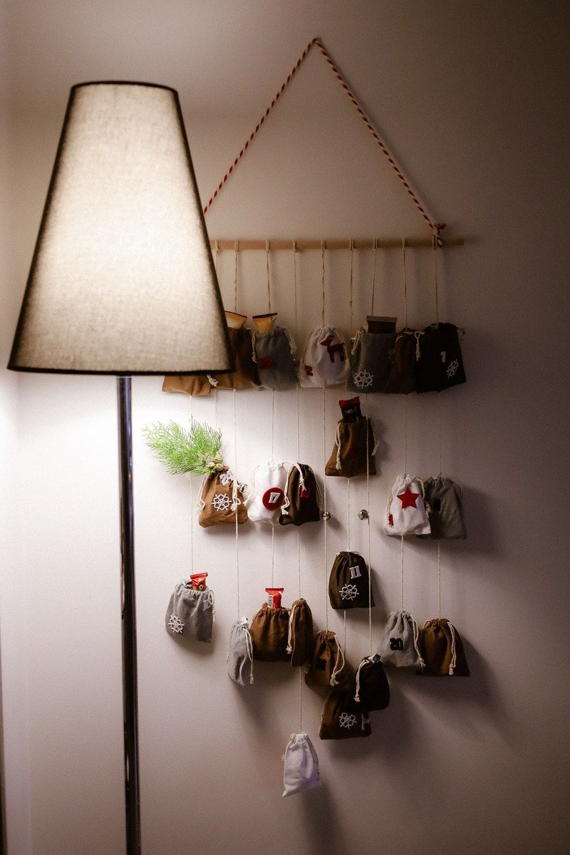 Treat pouches advent calendar hanging from a branch