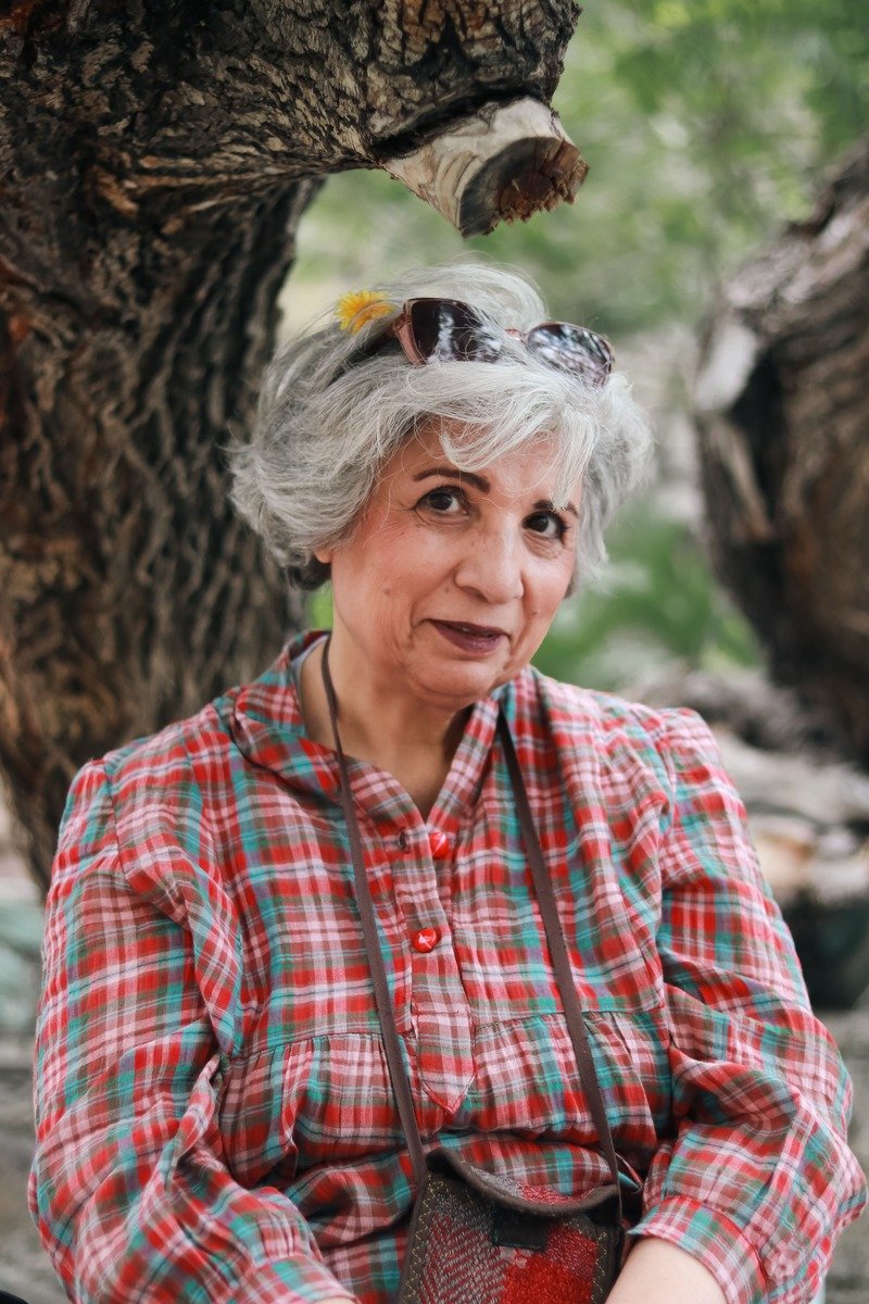 Woman over 50 with tousled wavy grey hair