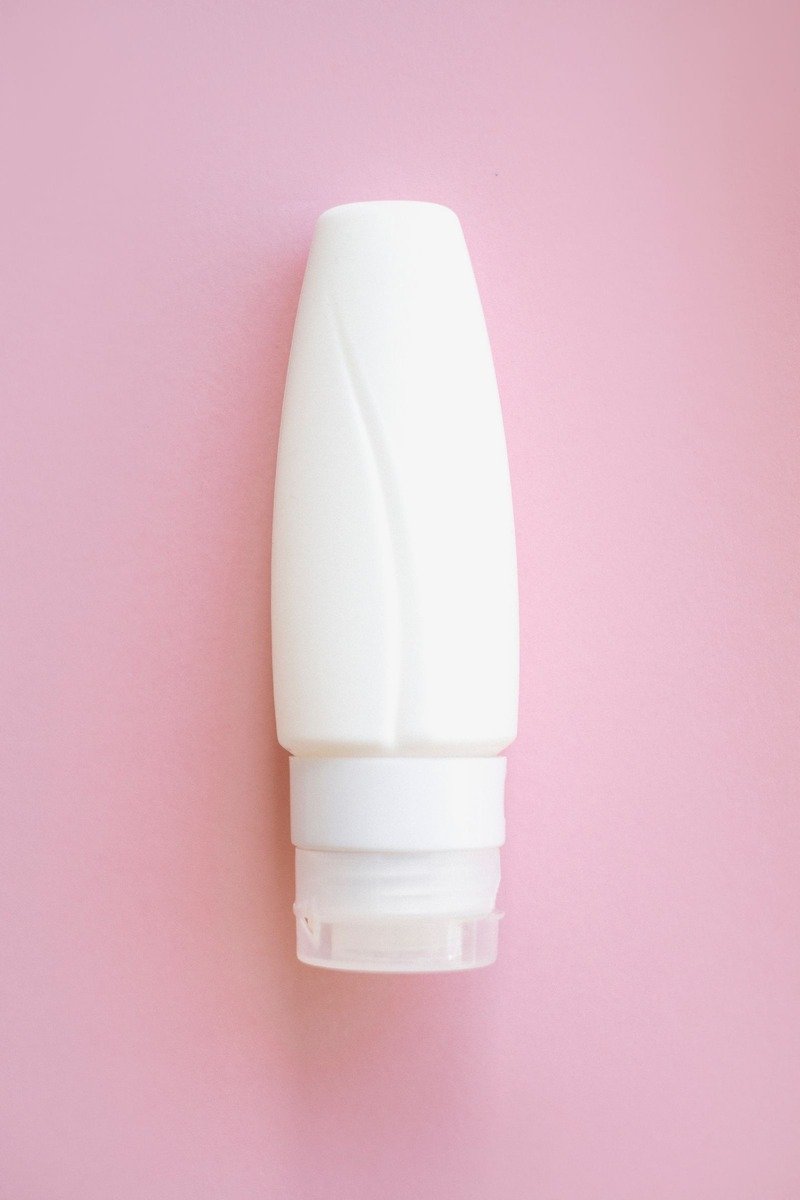 Retinol body serum in a glass dropper bottle