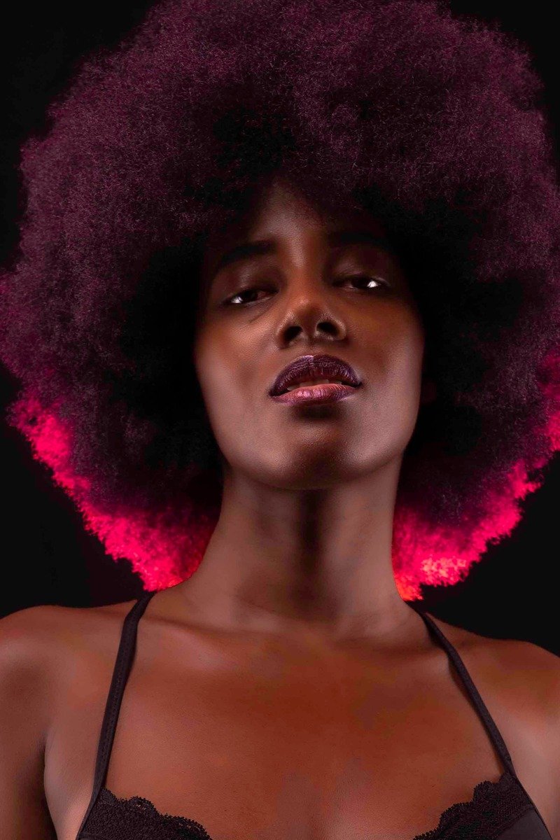 Natural coily hair in cherry cola color